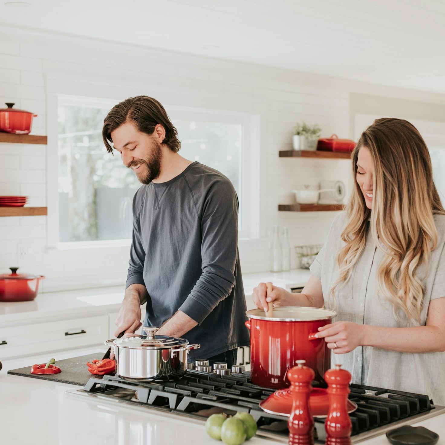 Community members collaborating in a modern kitchen space, exchanging recipes and techniques